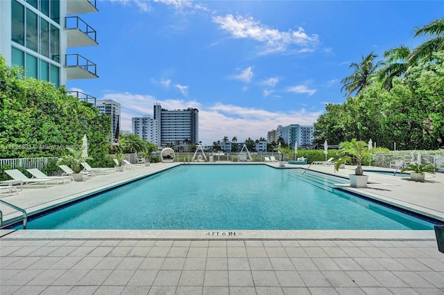 7930 E Dr Unit 1806, North Bay Village, FL 33141 - community pool with a patio and a view of city