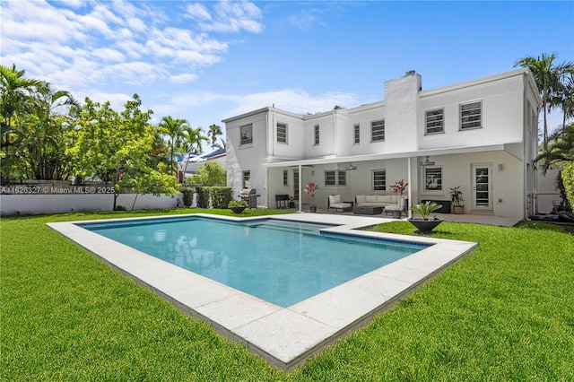 600 NE 55th Ter, Miami, FL 33137 - view of pool with an outdoor living space, a lawn, a patio, and ceiling fan