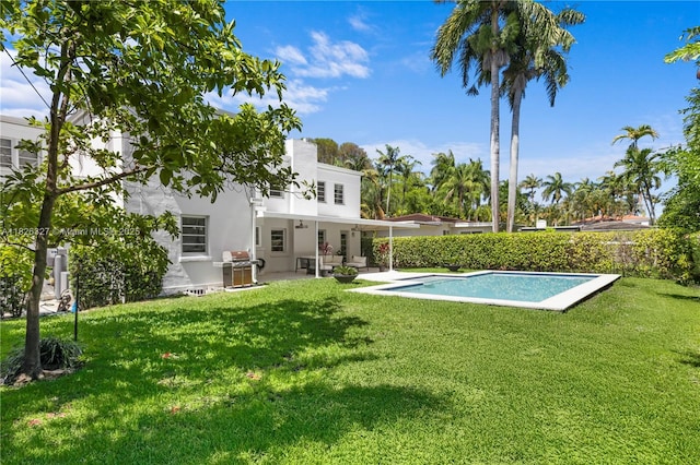 600 NE 55th Ter, Miami, FL 33137 - view of swimming pool featuring a yard, a patio area, and area for grilling