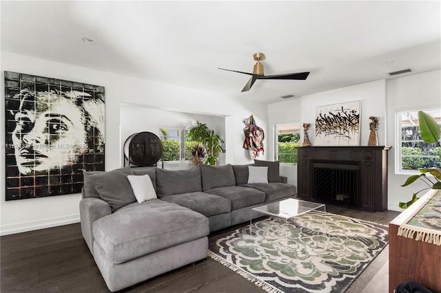 600 NE 55th Ter, Miami, FL 33137 - living room featuring plenty of natural light, ceiling fan, a fireplace with flush hearth, and dark wood-style floors
