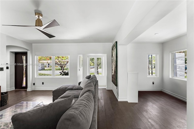 600 NE 55th Ter, Miami, FL 33137 - living room featuring a ceiling fan, dark wood-style flooring, and arched walkways