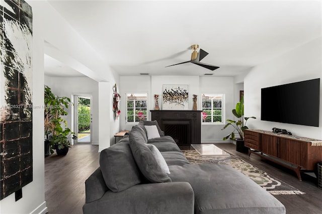 600 NE 55th Ter, Miami, FL 33137 - living room with a ceiling fan, dark wood finished floors, and a fireplace
