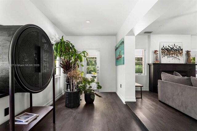 600 NE 55th Ter, Miami, FL 33137 - entrance foyer with dark wood finished floors and a fireplace