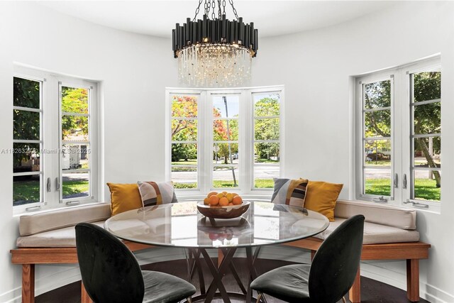 600 NE 55th Ter, Miami, FL 33137 - dining area with a chandelier and baseboards