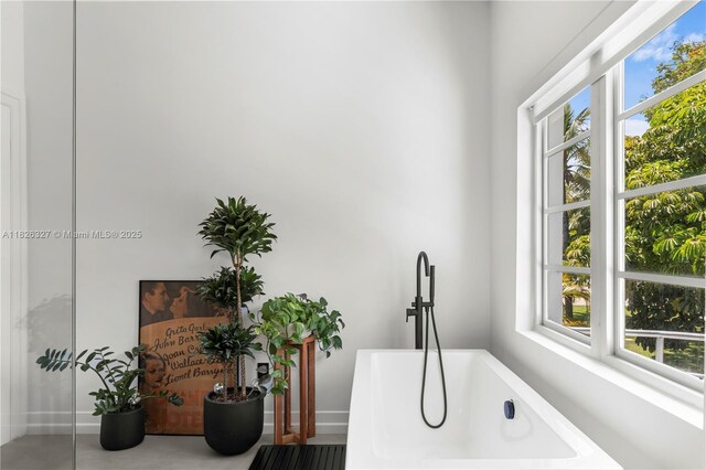 600 NE 55th Ter, Miami, FL 33137 - bathroom view of a freestanding tub and baseboards