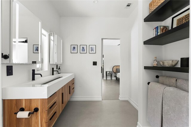 600 NE 55th Ter, Miami, FL 33137 - bathroom with finished concrete floors and double vanity