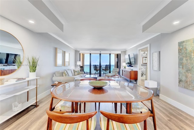 200 Ocean Trail Way Unit 701, Jupiter, FL 33477 - dining area with light wood-type flooring and crown molding