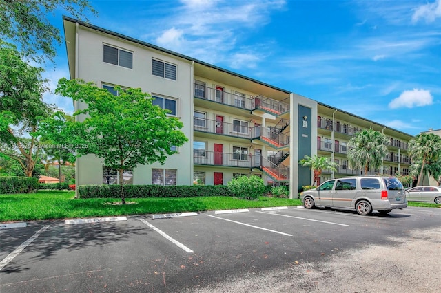 13355 SW 9th Ct Unit 413H, Pembroke Pines, FL 33027 - view of apartment building / complex featuring uncovered parking
