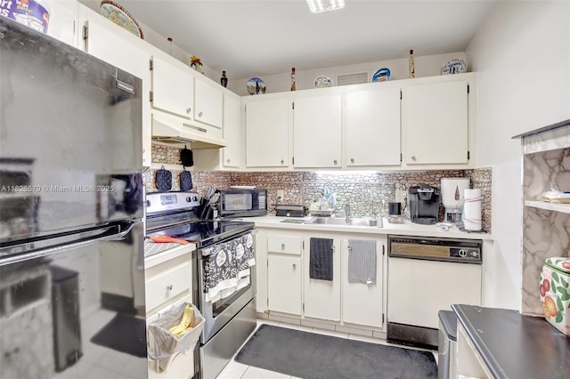 13355 SW 9th Ct Unit 413H, Pembroke Pines, FL 33027 - kitchen with freestanding refrigerator, stainless steel electric range oven, dishwasher, under cabinet range hood, and backsplash