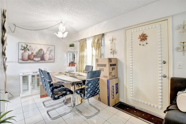 13355 SW 9th Ct Unit 413H, Pembroke Pines, FL 33027 - dining area with a textured ceiling and tile patterned floors