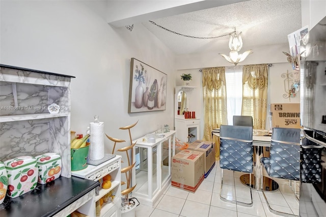 13355 SW 9th Ct Unit 413H, Pembroke Pines, FL 33027 - tiled dining space with a textured ceiling and a chandelier