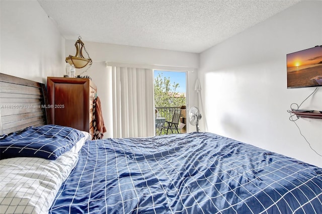 13355 SW 9th Ct Unit 413H, Pembroke Pines, FL 33027 - bedroom featuring a textured ceiling and access to outside