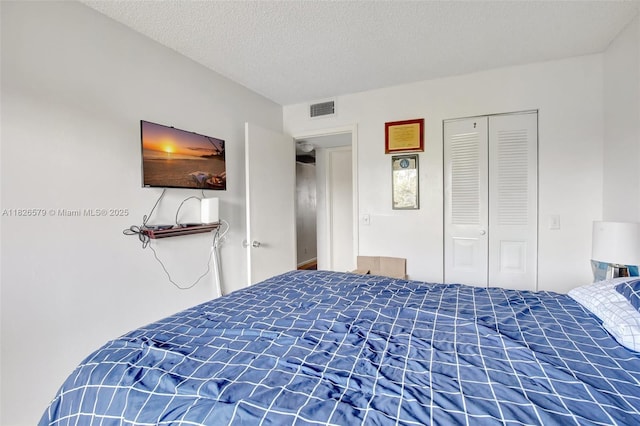 13355 SW 9th Ct Unit 413H, Pembroke Pines, FL 33027 - bedroom featuring a closet and a textured ceiling