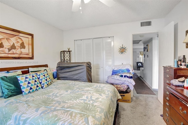 13355 SW 9th Ct Unit 413H, Pembroke Pines, FL 33027 - carpeted bedroom featuring a closet, a textured ceiling, and a ceiling fan