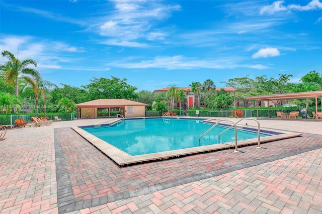 13355 SW 9th Ct Unit 413H, Pembroke Pines, FL 33027 - community pool featuring a patio area