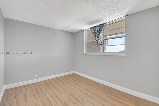 9311 Orange Grove Dr Unit 409, Davie, FL 33324 - empty room featuring a textured ceiling and wood finished floors
