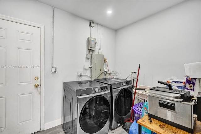 17415 NW 27th Ct, Miami Gardens, FL 33056 - washroom with separate washer and dryer, wood finished floors, and electric panel