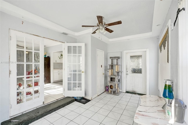 17415 NW 27th Ct, Miami Gardens, FL 33056 - foyer with a ceiling fan, a raised ceiling, light tile patterned floors, and french doors