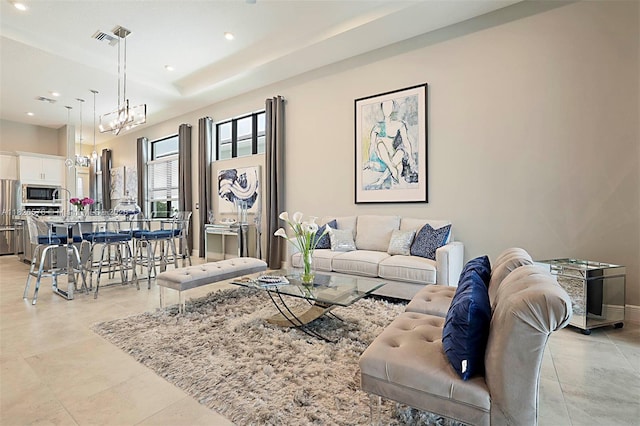 9190 SW Esule Way, Port St Lucie, FL 34987 - living room featuring light tile patterned floors and recessed lighting
