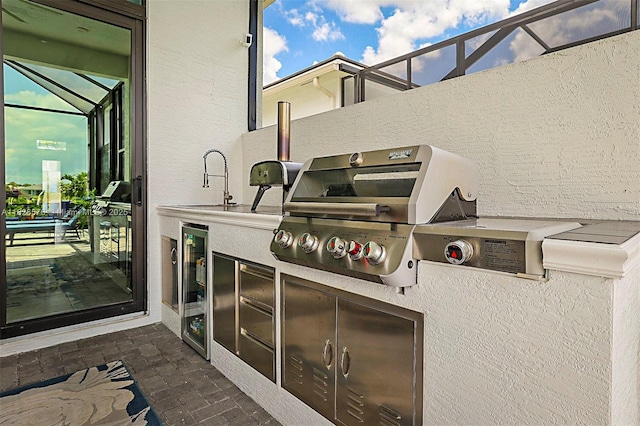 9190 SW Esule Way, Port St Lucie, FL 34987 - view of patio with wine cooler and an outdoor kitchen