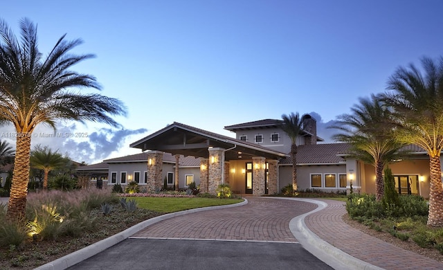 9190 SW Esule Way, Port St Lucie, FL 34987 - view of front of house featuring stucco siding and a tile roof
