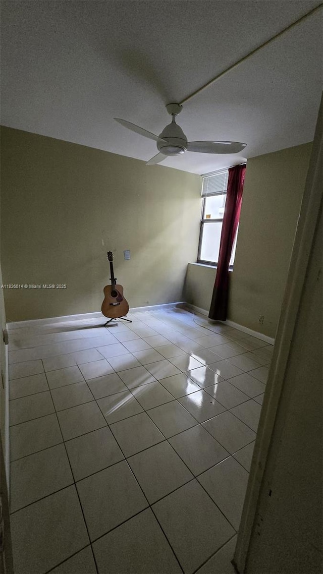 20441 NE 30th Ave Unit 114-9, Aventura, FL 33180 - empty room featuring tile patterned floors and ceiling fan