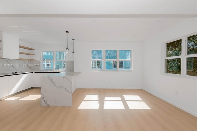 824 SE 12th Ct Unit 1, Fort Lauderdale, FL 33316 - kitchen with white cabinets, healthy amount of natural light, and open shelves