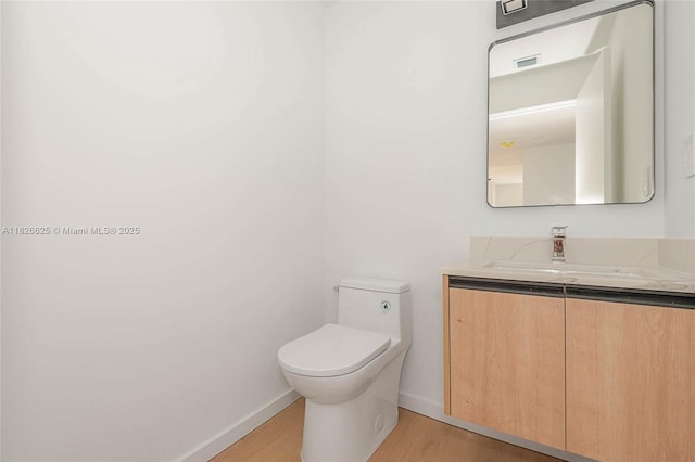 824 SE 12th Ct Unit 1, Fort Lauderdale, FL 33316 - half bath with vanity and wood finished floors