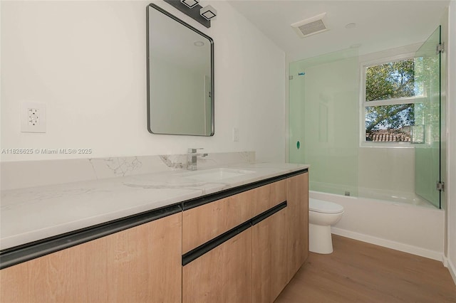 824 SE 12th Ct Unit 1, Fort Lauderdale, FL 33316 - bathroom featuring vanity, wood finished floors, and shower / bathtub combination
