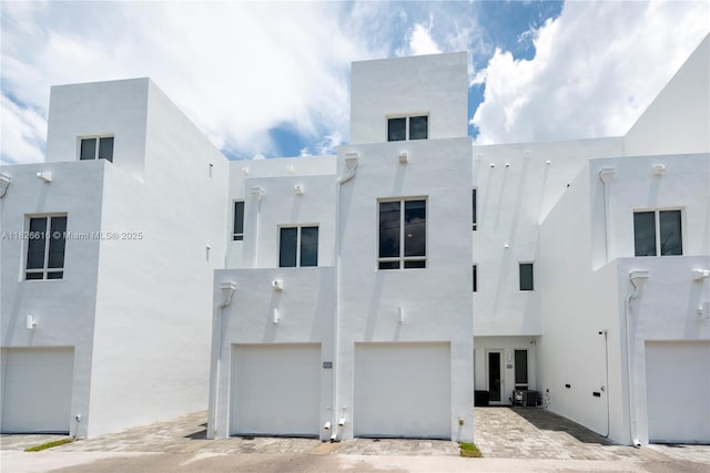 10260 NW 63rd Ter Unit 208, Doral, FL 33178 - view of front of home with an attached garage and stucco siding