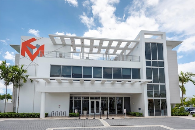 10260 NW 63rd Ter Unit 208, Doral, FL 33178 - view of building exterior with uncovered parking