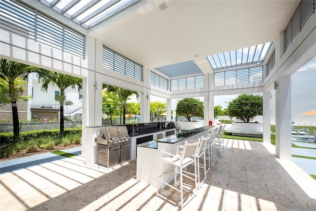 10260 NW 63rd Ter Unit 208, Doral, FL 33178 - wooden deck featuring an outdoor kitchen