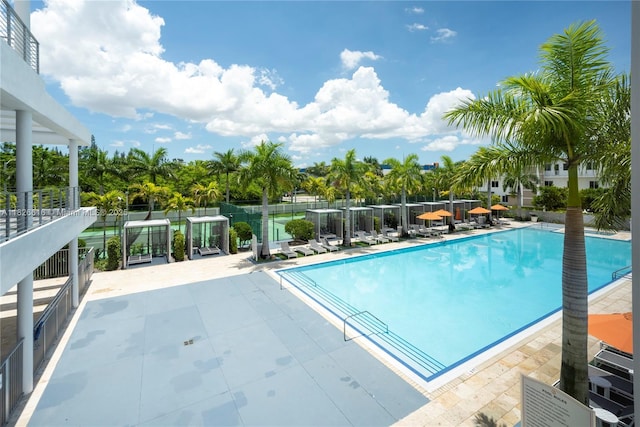 10260 NW 63rd Ter Unit 208, Doral, FL 33178 - community pool with a patio