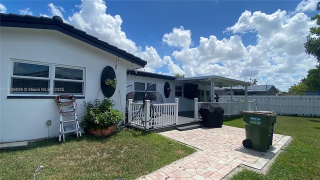 7809 NW 40th Ct, Coral Springs, FL 33065 - rear view of house featuring stucco siding and a patio