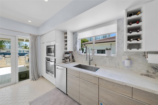 2010 NE 122nd Rd, North Miami, FL 33181 - kitchen with stainless steel appliances, modern cabinets, backsplash, open shelves, and recessed lighting