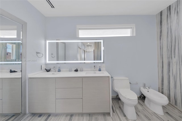 2010 NE 122nd Rd, North Miami, FL 33181 - full bathroom featuring a bidet, double vanity, and a shower