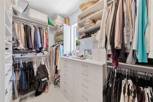 2010 NE 122nd Rd, North Miami, FL 33181 - walk in closet with light tile patterned flooring