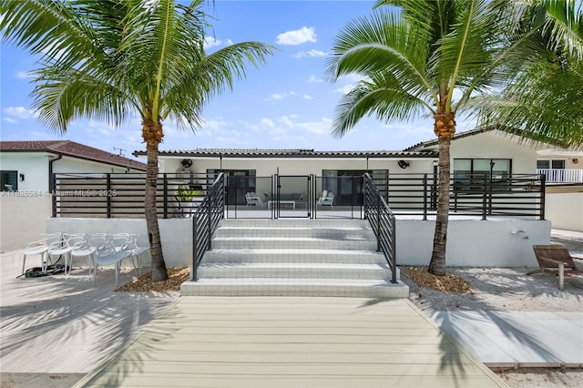 2010 NE 122nd Rd, North Miami, FL 33181 - back of property featuring stucco siding and a tile roof