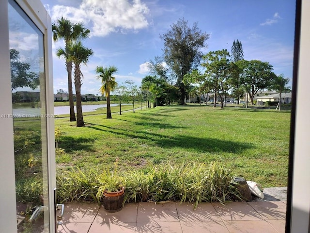 13791 Flora Pl Unit B, Delray Beach, FL 33484 - view of home's community with a water view and a yard