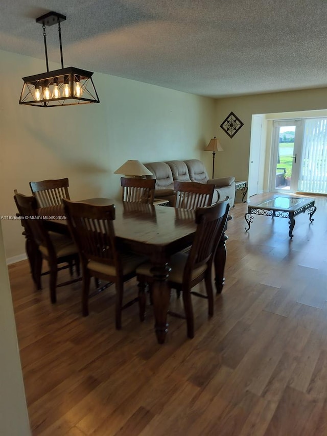 13791 Flora Pl Unit B, Delray Beach, FL 33484 - dining space with wood finished floors and a textured ceiling