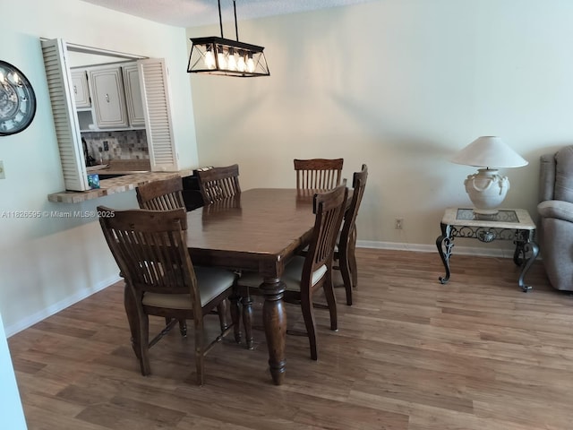 13791 Flora Pl Unit B, Delray Beach, FL 33484 - dining space with wood finished floors and baseboards
