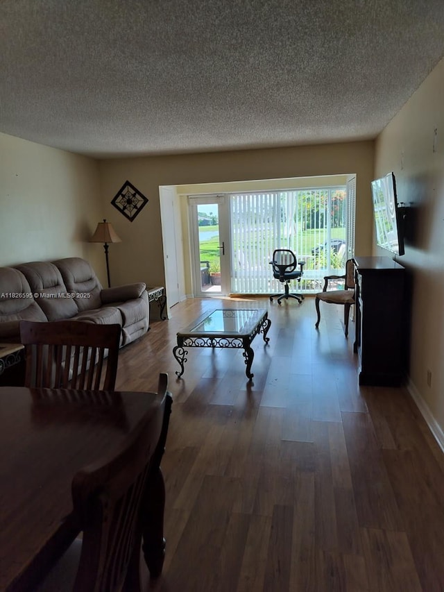 13791 Flora Pl Unit B, Delray Beach, FL 33484 - dining room featuring a textured ceiling and wood finished floors
