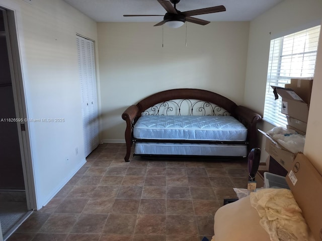 13791 Flora Pl Unit B, Delray Beach, FL 33484 - bedroom featuring a ceiling fan and stone finish floors