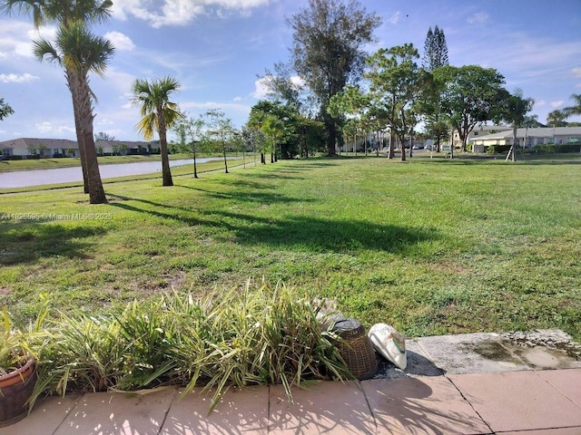 13791 Flora Pl Unit B, Delray Beach, FL 33484 - view of grassy yard featuring a water view