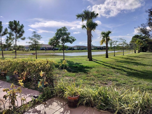 13791 Flora Pl Unit B, Delray Beach, FL 33484 - view of green lawn featuring a water view