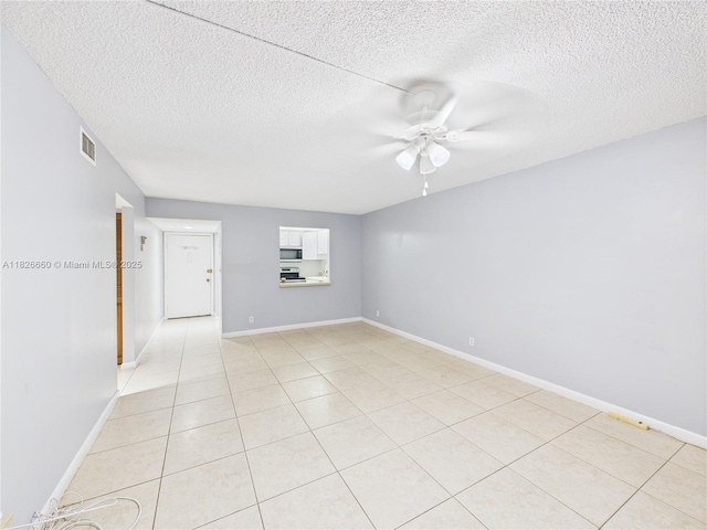 4113 NW 88th Ave Unit 105, Coral Springs, FL 33065 - empty room featuring ceiling fan, a textured ceiling, and light tile patterned flooring