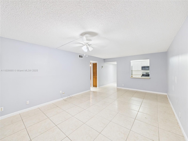 4113 NW 88th Ave Unit 105, Coral Springs, FL 33065 - empty room with ceiling fan, a textured ceiling, and light tile patterned floors