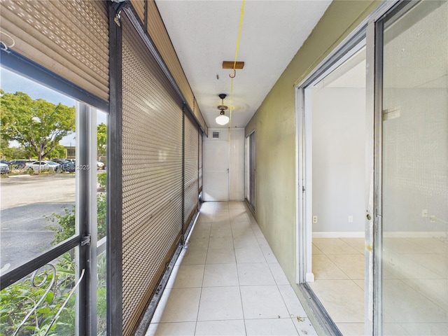 4113 NW 88th Ave Unit 105, Coral Springs, FL 33065 - corridor with light tile patterned floors