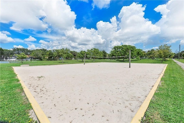 4113 NW 88th Ave Unit 105, Coral Springs, FL 33065 - view of community featuring volleyball court and view of wooded area
