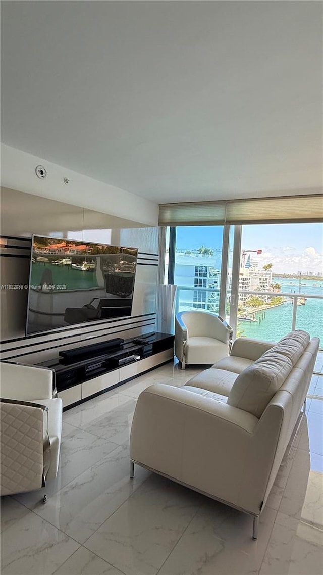 9821 E Bay Harbor Dr Unit 903, Bay Harbor Islands, FL 33154 - living area featuring marble finish flooring and a water view